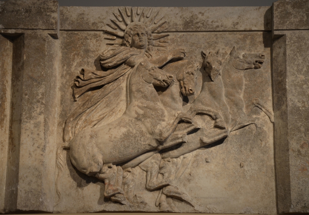 Architrave_with_sculpted_metope_depicting_the_Sun_God_Helios_in_quadriga,_from_the_Temple_of_Athena_at_Ilion-Troy_(Schliemann's_excavation_1872),_300-280_BC,_Altes_Museum_(14145626535).jpg